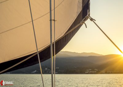 Sun shines through a sail on the east coast of Lefkada, Greece